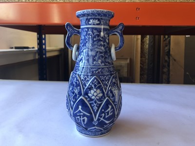 Lot 14 - A CHINESE BLUE AND WHITE LOOP-HANDLED 'LONGEVITY' VASE.