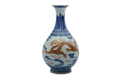 Lot 751 - A CHINESE BLUE AND WHITE AND OVERGLAZE RED 'DRAGON' BOTTLE VASE.