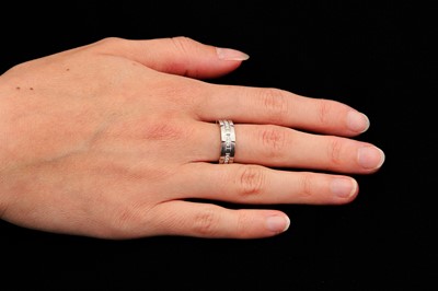 Lot 92 - A diamond 'Tank Française' ring, by Cartier
