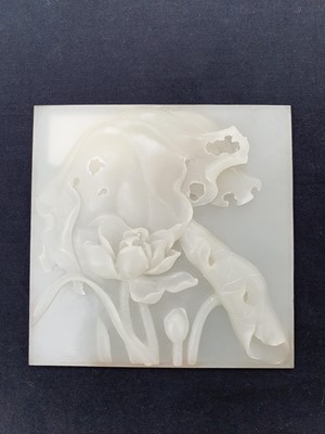 Lot 163 - A CONTEMPORARY CHINESE WHITE JADE SQUARE 'LOTUS' PLAQUE.