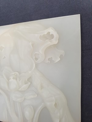 Lot 31 - A CHINESE WHITE JADE SQUARE 'LOTUS' PLAQUE.