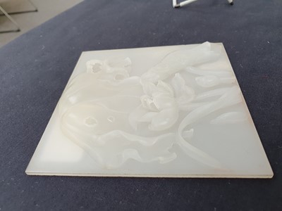 Lot 80 - A CHINESE WHITE JADE SQUARE 'LOTUS' PLAQUE.