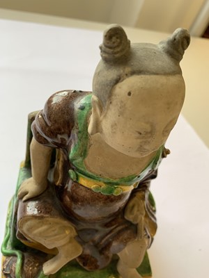 Lot 57 - A CHINESE FAMILLE VERTE SANCAI FIGURE OF AN IMMORTAL.