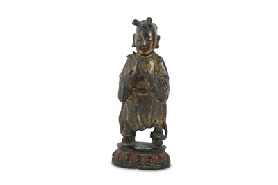 Lot 321 - A CHINESE LACQUERED AND GILT-BRONZE FIGURE OF A  BOY.