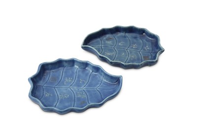 Lot 758 - A PAIR OF CHINESE BLUE-GLAZED 'LEAF' TRAYS.