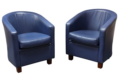 Lot 145 - A pair of 20th Century blue leather upholstered tub chairs