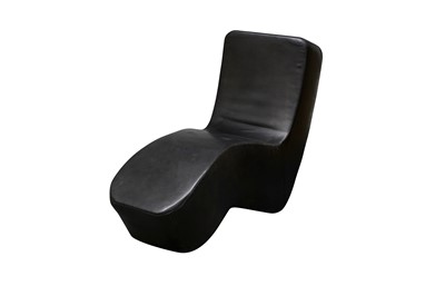 Lot 128 - A modernist black leather chaise lounge