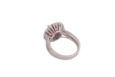 Lot 119 - A ruby and diamond cluster ring