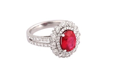 Lot 119 - A ruby and diamond cluster ring