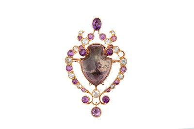 Lot 250 - An amethyst and gem-set brooch / pendant, circa 1925