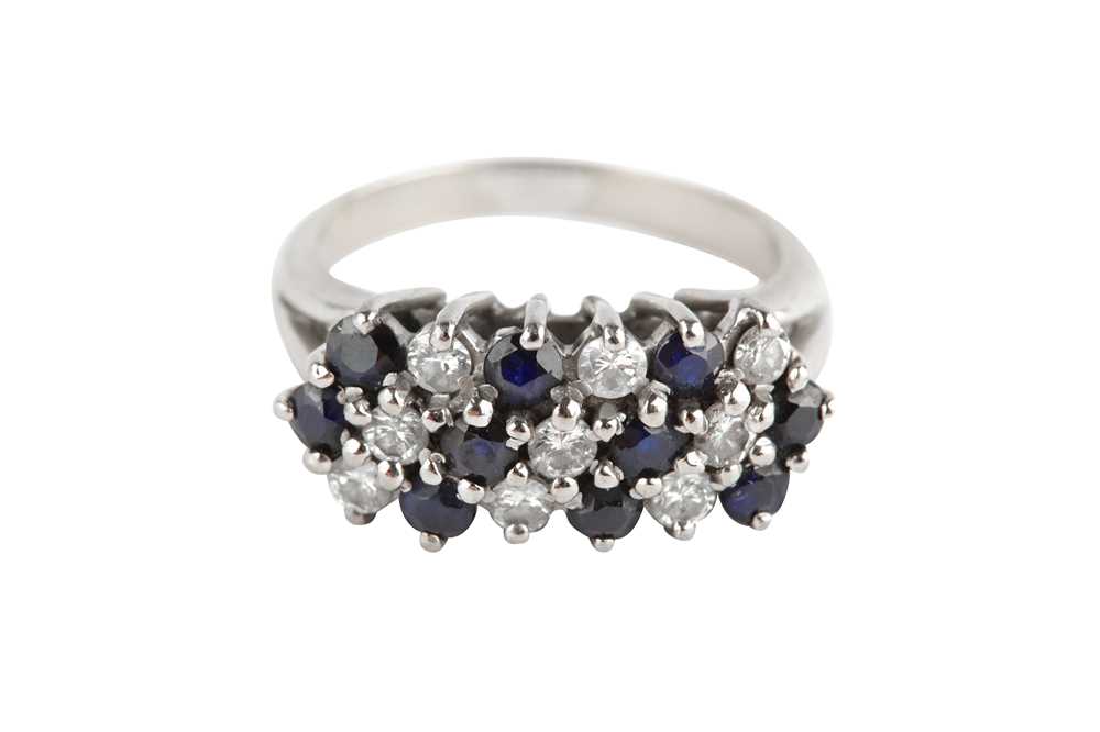 Lot 123 - a sapphire and diamond cluster ring