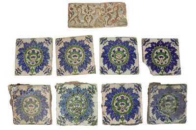 Lot 227 - A group of eight Iznik-style pottery tiles and a copper lustre-painted wall tile