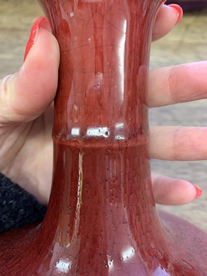 Lot 118 - A CHINESE COPPER RED-GLAZED GARLIC NECKED VASE.
