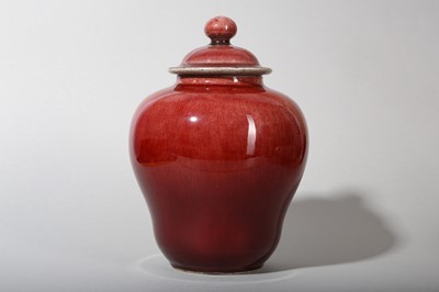 Lot 125 - A CHINESE COPPER RED-GLAZED JAR AND COVER.