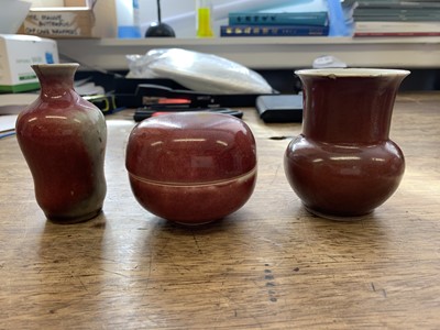 Lot 129 - THREE CHINESE COPPER RED-GLAZED SCHOLAR'S DESK ITEMS.