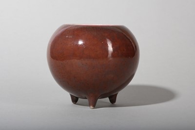 Lot 148 - A CHINESE COPPER RED-GLAZED TRIPOD WATER POT.