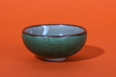 Lot 149 - A CHINESE GREEN-GLAZED BOWL.