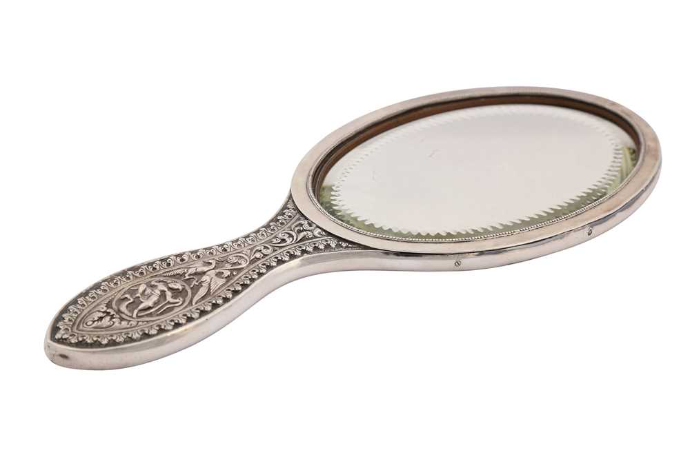 Lot 214 A SILVER REPOUSSÉ HANDHELD MIRROR