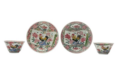 Lot 632 - A NEAR-PAIR OF CHINESE FAMILLE ROSE 'COCKERELS' CUPS AND SAUCERS.