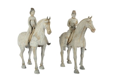 Lot 658 - A PAIR OF CHINESE POTTERY HORSERIDERS.