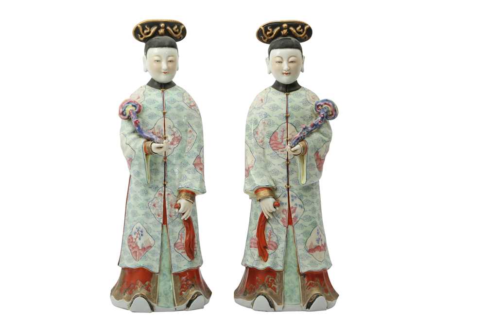 Lot 560 - A PAIR OF CHINESE FAMILLE ROSE FIGURES OF LADIES.