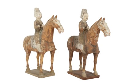 Lot 661 - A PAIR OF CHINESE POTTERY HORSERIDERS.