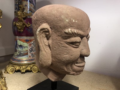 Lot 1110 - A CHINESE STONE HEAD OF AN ARHAT.