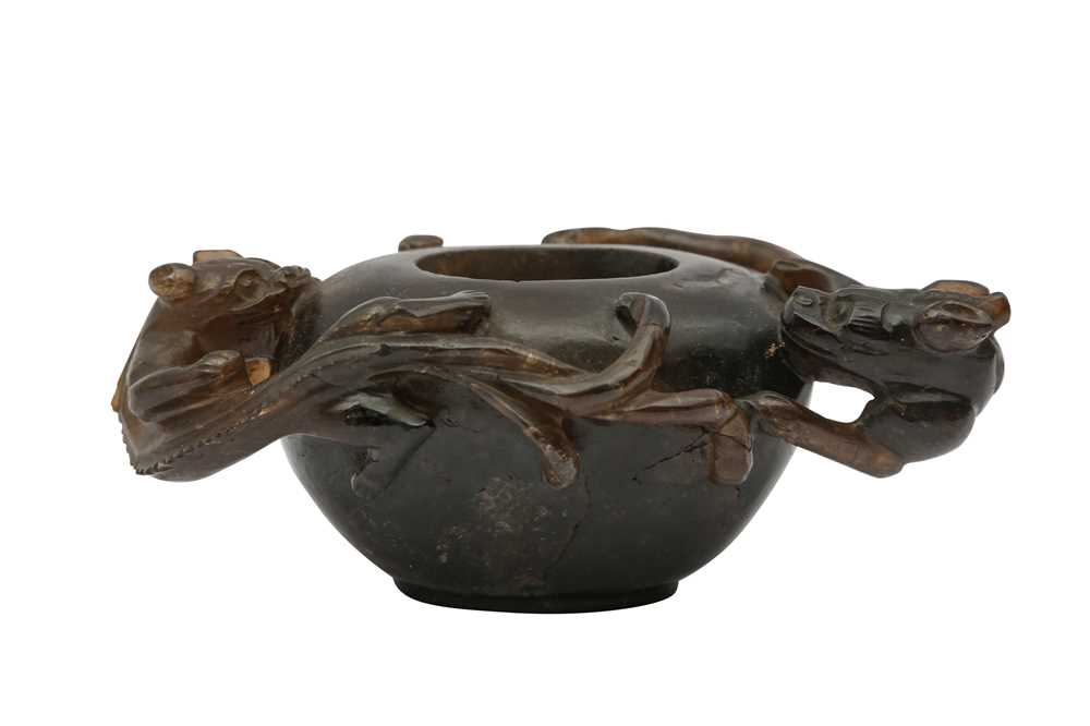 Lot 703 - A CHINESE SMOKY CRYSTAL CARVED CHILONG WASHER.