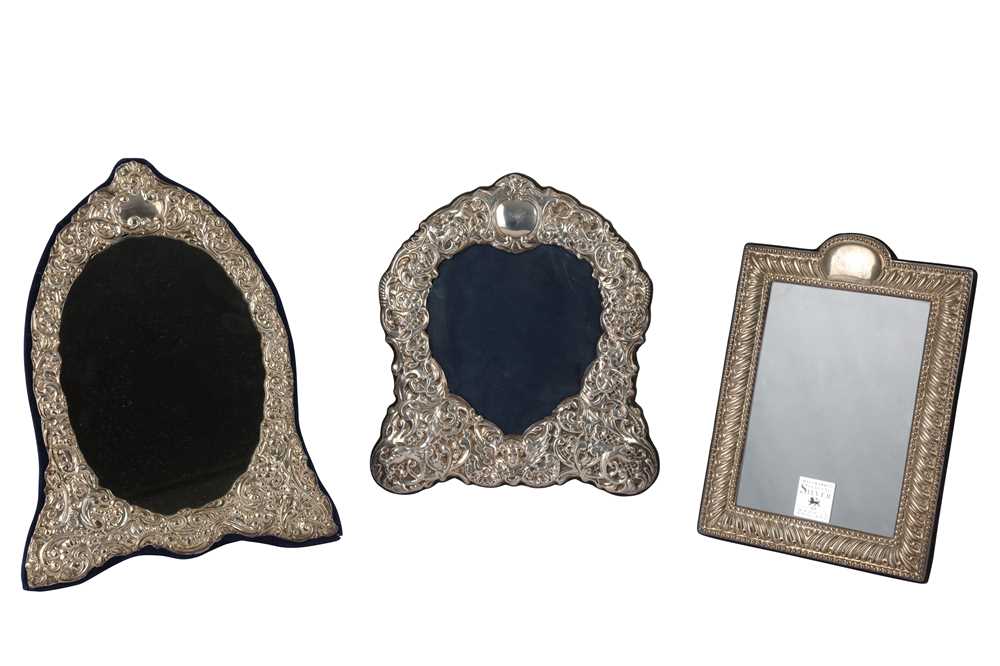 Lot 21 - Two silver photograph frames and a mirror