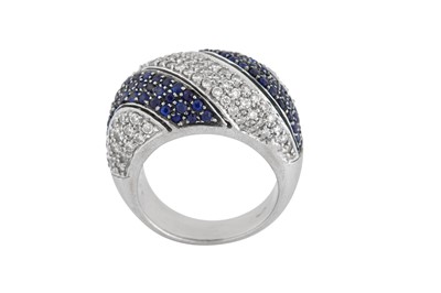 Lot 144 - A sapphire and diamond dress ring.