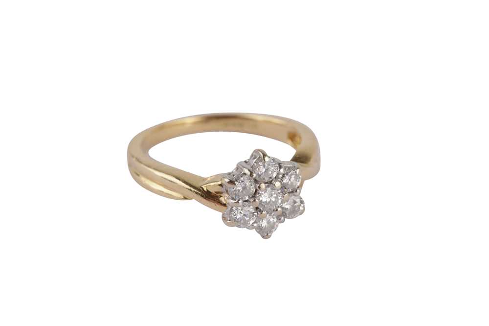 Lot 107 - An 18 carat gold diamond cluster ring