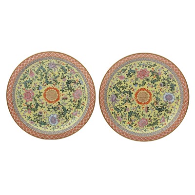 Lot 627 - A pair of Chinese famille-rose yellow-ground dishes, 20th century