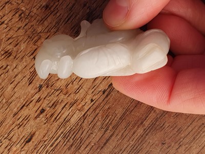 Lot 88 - A CHINESE WHITE JADE 'BOY AND CAT' GROUP.