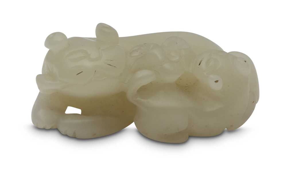 Lot 434 - A CHINESE WHITE JADE 'CATS' CARVING.