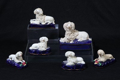 Lot 193 - A pair of Staffordshire pottery poodle and pup groups