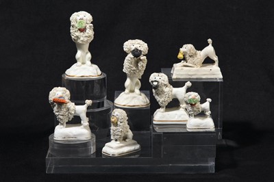 Lot 196 - A near pair of Staffordshire poodles, circa 1820-50