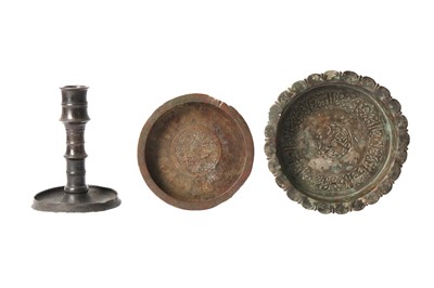 Lot 115 - TWO COPPER ALLOY ENGRAVED DISHES AND A CANDLESTICK