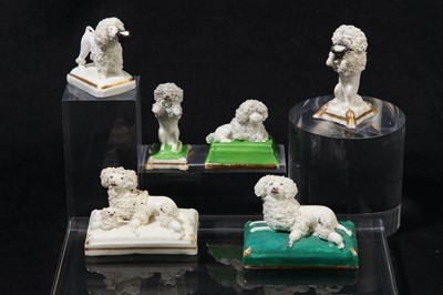 Lot 199 - A near pair of Staffordshire porcelain poodles, circa 1820-50