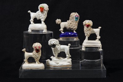 Lot 200 - A collection of five Staffordshire poodles