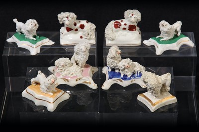 Lot 206 - A collection of eight Staffordshire toy poodle groups