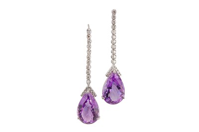 Lot 10 - A pair of amethyst and diamond pendent earrings