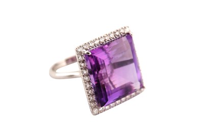 Lot 204 - An amethyst and diamond cluster ring