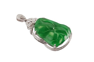 Lot 235 - A jade and diamond pendant