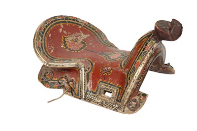 Lot 923 - λ A POLYCHROME-PAINTED AND LACQUERED WOODEN SADDLE