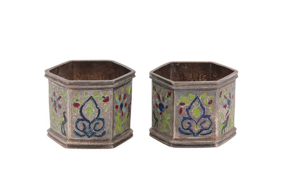 Lot 195 - A pair of early 20th century Iranian (Persian) silver and champlevé enamel napkin rings, probably Rasht circa 1910