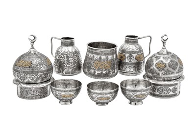 Lot 278 - An early 20th century Syrian gold inlaid unmarked silver six-piece Turkish coffee set, Damascus circa 1920