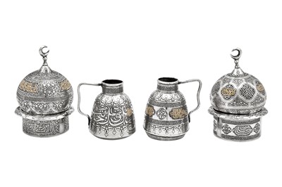 Lot 278 - An early 20th century Syrian gold inlaid unmarked silver six-piece Turkish coffee set, Damascus circa 1920