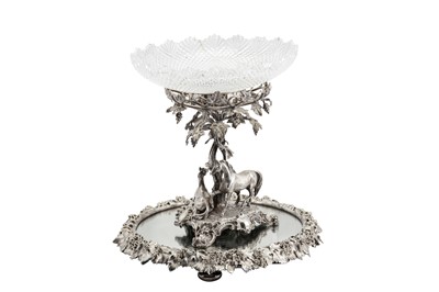 Lot 282 - A Victorian silver plated (EPNS) figural centrepiece on a mirror plateau, circa 1860, the centrepiece by Barnards