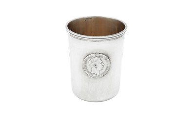 Lot 176 - A late 19th century German unmarked silver coin set beaker, circa 1889