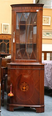 Lot 75 - A Georgian style mahogany corner cupboard with...